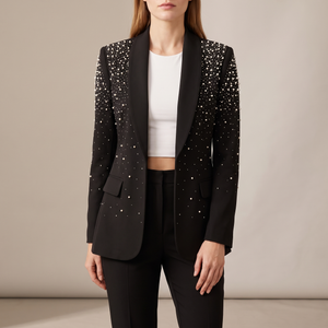 Adrienne pearl detail blazer in Black on a light gray studio backdrop