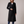 Agathe long double breasted coat in Black on a light gray studio backdrop