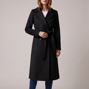 Agathe long double breasted coat in Black on a light gray studio backdrop