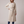 Agathe long double breasted coat in Cream on a light gray studio backdrop