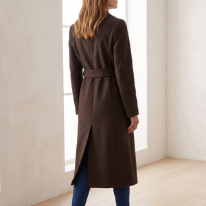Back view of the Agathe long double breasted coat in Dark Brown showing the back vent