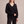Annabel cashmere V neck sweater in Black on a light gray studio backdrop
