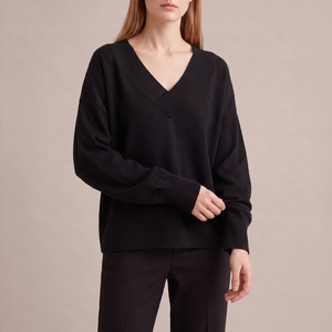 Annabel cashmere V neck sweater in Black on a light gray studio backdrop