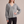Annabel cashmere V neck sweater in Gray on a light gray studio backdrop