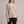 Annabel cashmere V neck sweater in Beige on a light gray studio backdrop