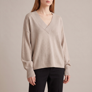 Annabel cashmere V neck sweater in Beige on a light gray studio backdrop