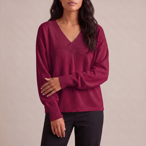 Annabel cashmere V neck sweater in Wine on a light gray studio backdrop