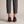 Ariane suede kitten heel pumps in Brown seen from behind on a light gray studio backdrop