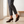 Ariane suede kitten heel pumps in Brown worn by a window in a bright room with a pale oak floor