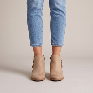 Beatrice suede ankle boots in Beige seen from the front on a light gray studio backdrop