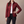 Belinda quilted jacket in Dark Red with one hand on the hip on a light gray studio backdrop