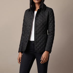 Belinda quilted jacket in Black with a turn down collar on a light gray studio backdrop