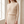 Close view of the Bonnie ribbed knit set in Beige showing the chevron rib and the waistband