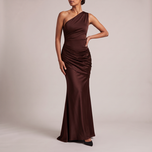 Cecily one shoulder satin maxi dress in Brown on a light gray studio backdrop