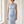 Close view of the Cecily one shoulder neckline and draped waist in Light Blue