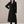 Celeste long wool coat in Black on a light gray studio backdrop