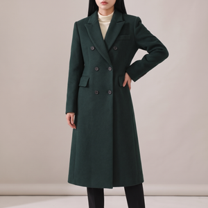Celeste long wool coat in Dark Green on a light gray studio backdrop