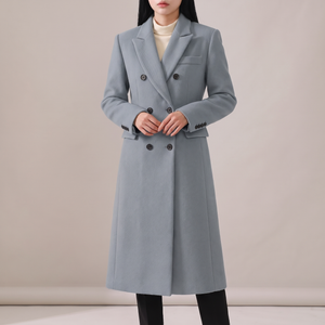 Celeste long wool coat in Gray on a light gray studio backdrop
