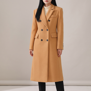 Celeste long wool coat in Camel on a light gray studio backdrop
