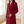 Close view of the Red Celeste coat flap pocket, chest welt pocket and buttoned cuff