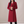 Celeste long wool coat in Red on a light gray studio backdrop