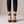 Clarisse block heel pumps in Black seen from the front on a light gray studio backdrop