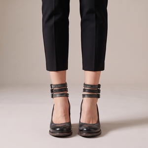 Clarisse block heel pumps in Black seen from the front on a light gray studio backdrop