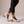 Clarisse block heel pumps in Ivory seen from the side on a light gray studio backdrop
