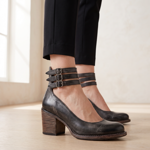Close view of the three buckled ankle straps on the Clarisse block heel pumps in Black
