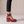 Clarisse block heel pumps in Red Snake Print seen from the side on a light gray studio backdrop