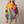 Clemency patchwork sun hoodie on a light gray studio backdrop