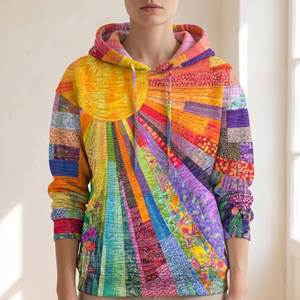 Hood, drawstrings and patchwork sun on the Clemency patchwork sun hoodie