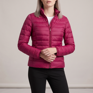Clementine quilted down jacket in Fuchsia on a light gray studio backdrop