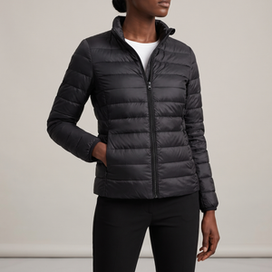Clementine quilted down jacket in Black on a light gray studio backdrop
