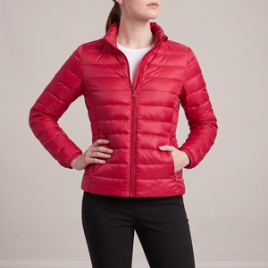 Clementine quilted down jacket in Red on a light gray studio backdrop