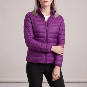 Clementine quilted down jacket in Violet on a light gray studio backdrop