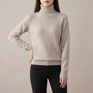 Cressida cashmere turtleneck sweater in Beige on a light gray studio backdrop