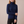Cressida cashmere turtleneck sweater in Dark Blue on a light gray studio backdrop