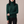 Cressida cashmere turtleneck sweater in Dark Green on a light gray studio backdrop