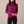Cressida cashmere turtleneck sweater in Fuchsia on a light gray studio backdrop