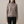 Cressida cashmere turtleneck sweater in Taupe on a light gray studio backdrop