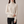 Cressida cashmere turtleneck sweater in Ivory on a light gray studio backdrop