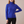 Cressida cashmere turtleneck sweater in Royal Blue on a light gray studio backdrop
