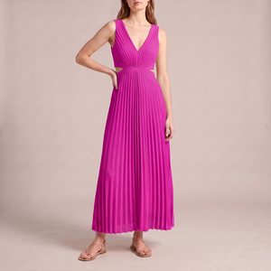 Cristina pleated maxi dress in Fuchsia on a light gray studio backdrop