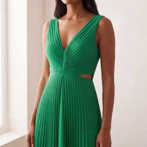 Close front view of the Cristina dress in Green showing the V neckline, gathered pleated bodice and side cutouts