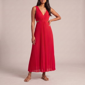 Cristina pleated maxi dress in Red on a light gray studio backdrop