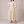 Eliza maxi shirt dress in Cream on a light gray studio backdrop