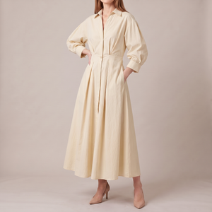 Eliza maxi shirt dress in Cream on a light gray studio backdrop