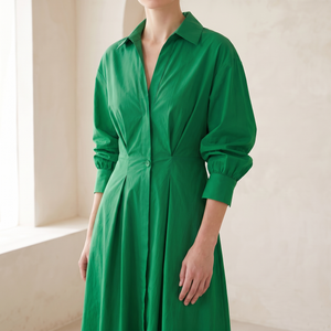 Close view of the collar, wrap neckline and waist button of the Eliza maxi shirt dress in Green