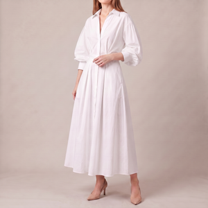 Eliza maxi shirt dress in White on a light gray studio backdrop